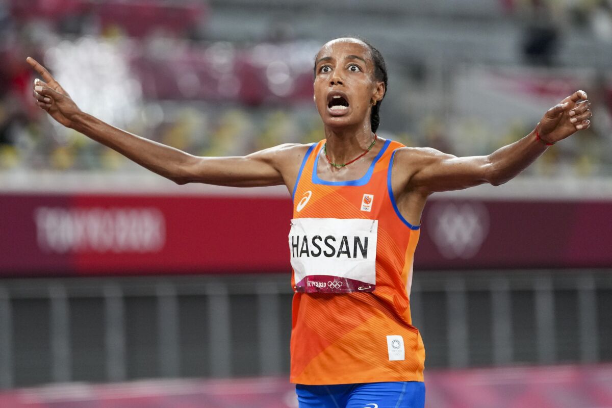 Sifan Hassan, of the Netherlands, celebrates after winning the gold medal in the women's 5,000-meter final at the 2020 Summer Olympics, Monday, Aug. 2, 2021, in Tokyo. (AP Photo/Matthias Schrader)