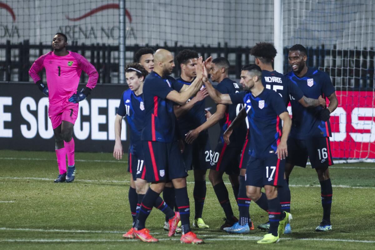 U.S. players celebrate their fourth goal during the international friendly against Jamaica on March 25.