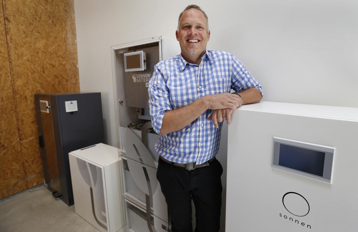 Boris von Bormann, chief executive of Sonnen Inc., stands with a variety of the company's residential electricity storage units at its U.S. headquarters in North Hollywood.