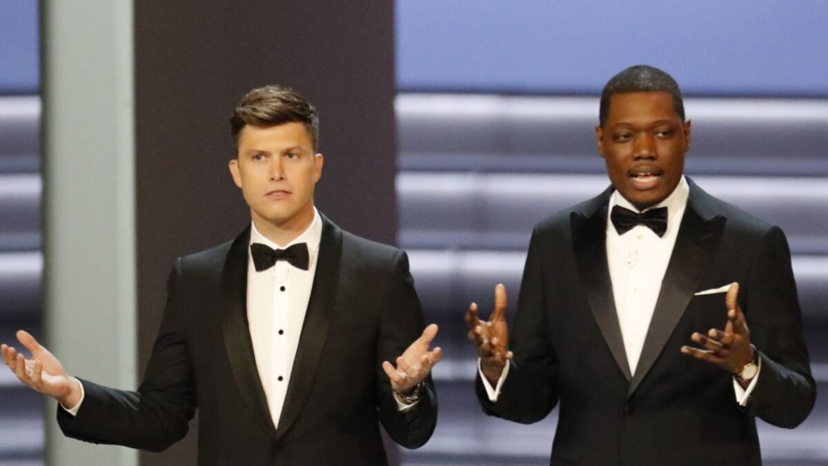 Colin Jost and Michael Che host the 70th Primetime Emmy Awards at the Microsoft Theater in Los Angeles.