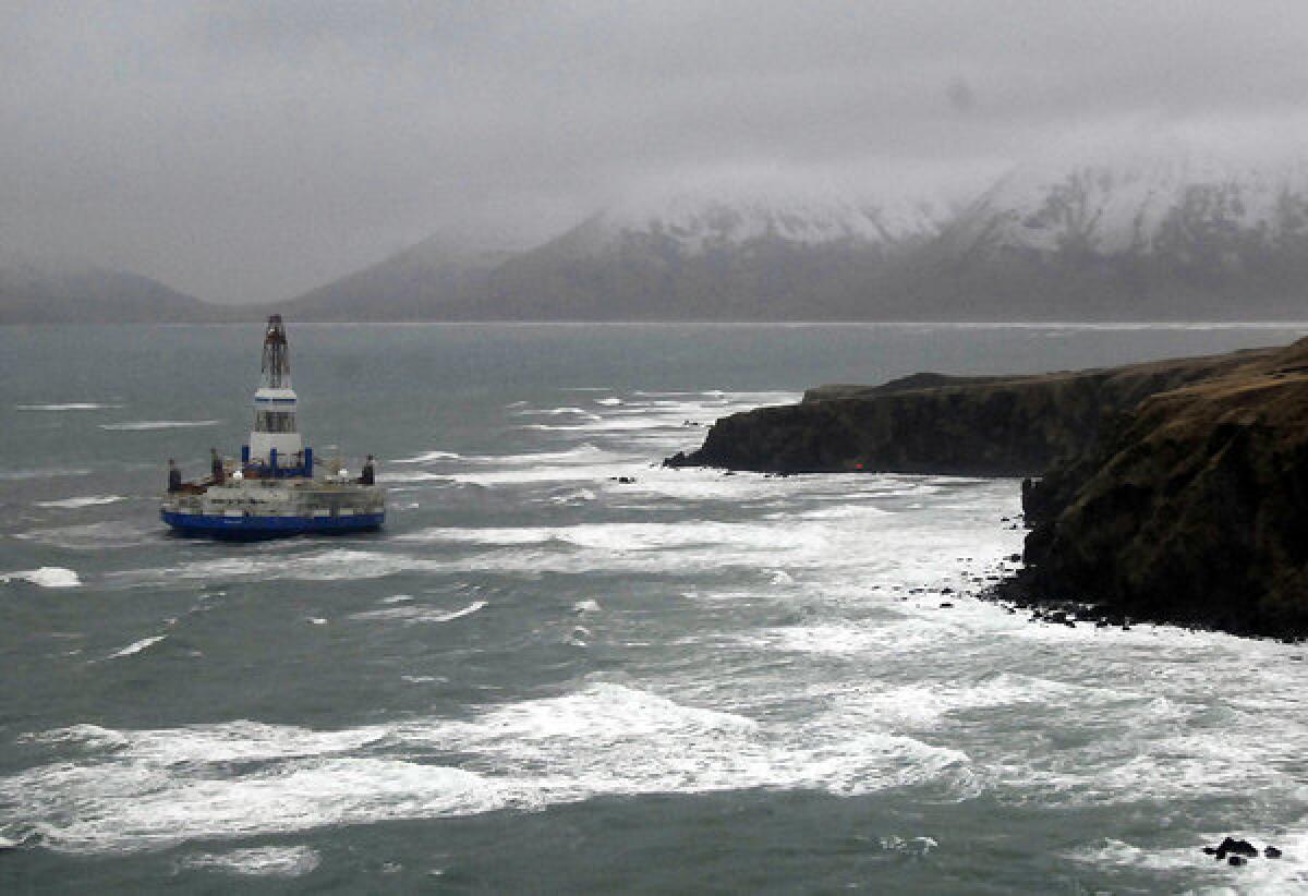 The Shell drilling rig Kulluk aground off a small island near Kodiak Island. Weather may affect retrieval efforts.