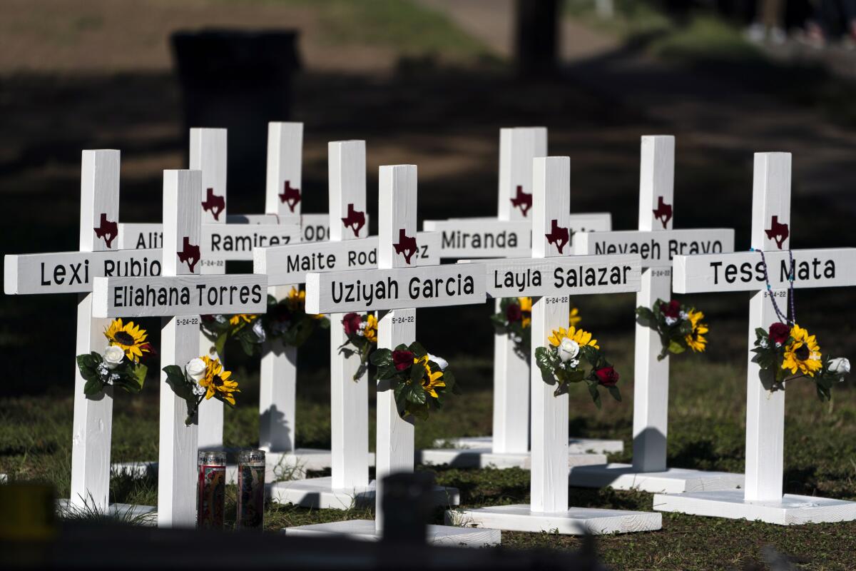 Crosses with the names of Tuesday's shooting victims are placed outside Robb Elementary School in Uvalde, Texas.