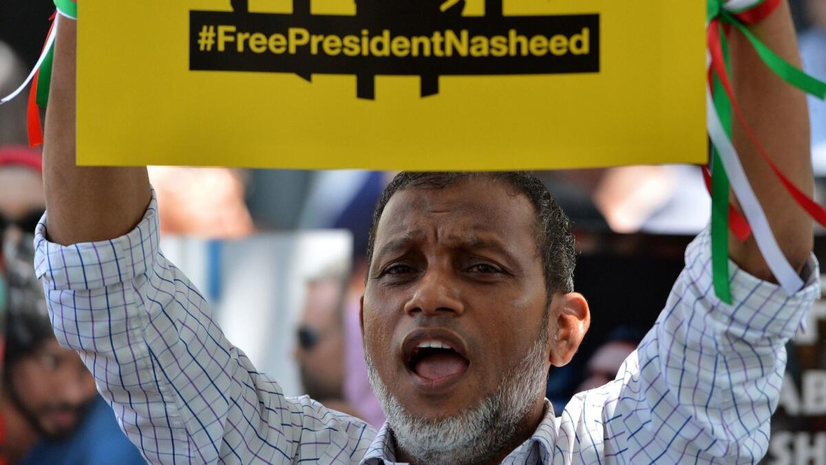A supporter of Mohamed Nasheed shouts slogans during a protest in Colombo, Sri Lanka, in March 2018.