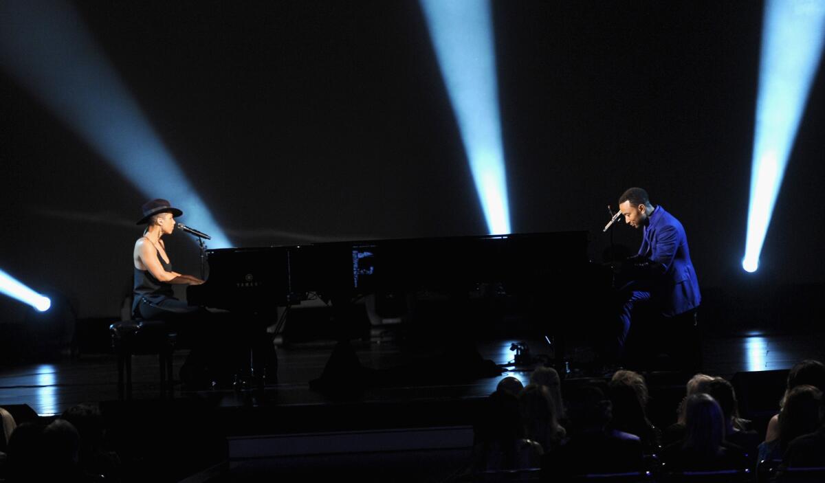 Alicia Keys and John Legend perform at the Los Angeles Convention Center on Jan. 27, 2014.