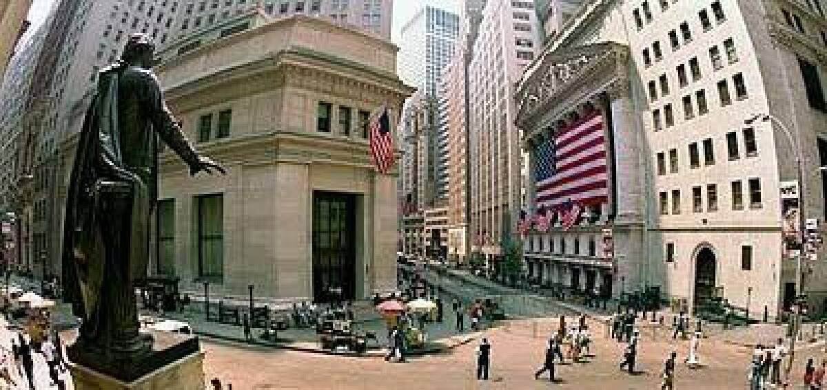 A statue of Washington overlooks Wall Street and the New York Stock Exchange, at right.