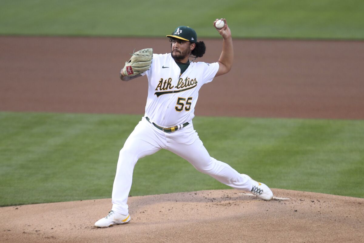 Oakland Athletics' Sean Manaea throws to a Tampa Bay Rays batter during the first inning of a baseball game in Oakland, Calif., Friday, May 7, 2021. (AP Photo/Jed Jacobsohn)
