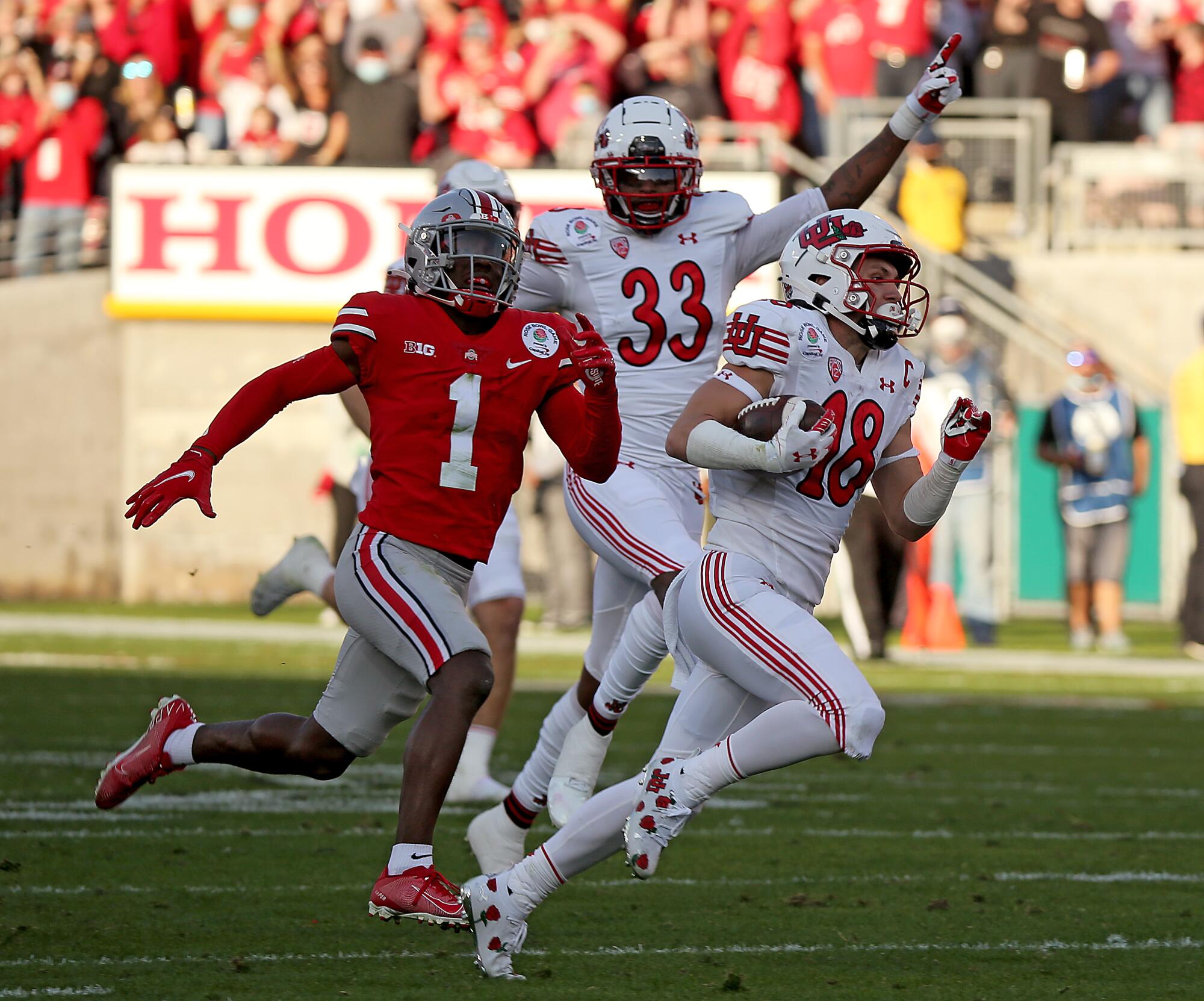 Utah's Britain Covey returns a kickoff for a touchdown.