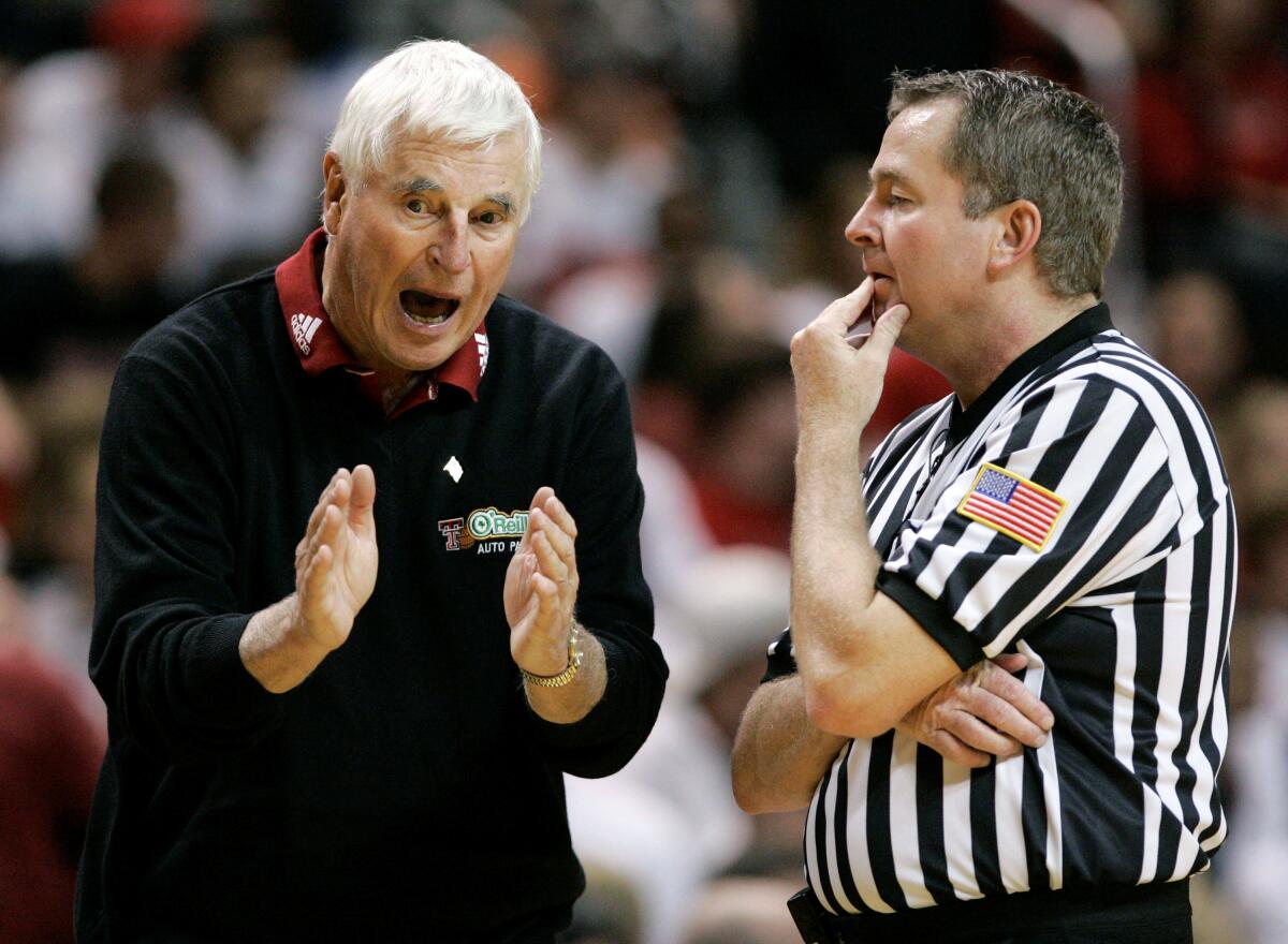 Then-Texas Tech coach Bob Knight argues with a referee during a basketball game against Texas A&M