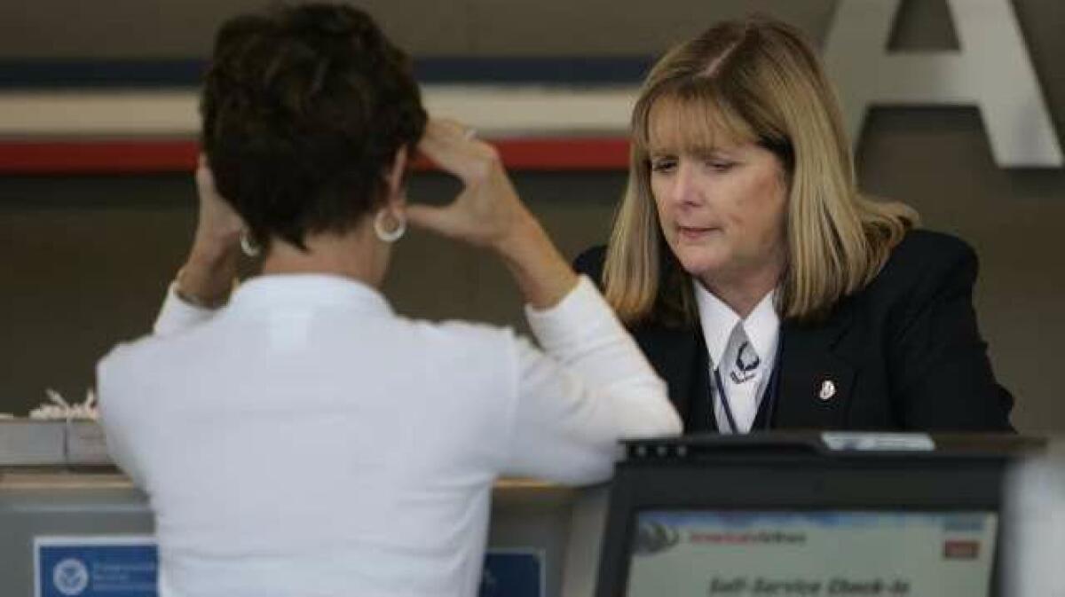 A traveler shows frustration at Ontario International Airport in the aftermath of a canceled flight. (Gina Ferazzi / Los Angeles Times)