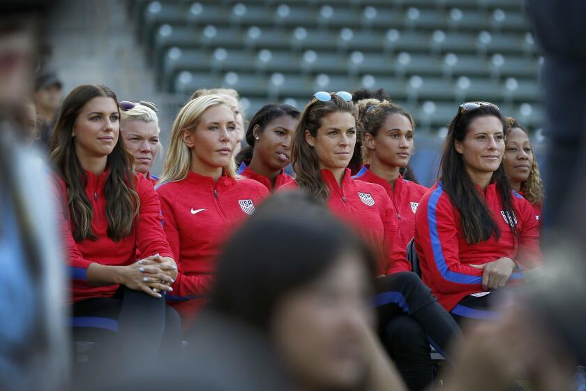 CARSON, CALIF. -- MONDAY, JULY 31 2017: Members of the U.S. Women's Soccer Team listen to LA Mayor Eric Garcetti speak during news conference at the StubHub Center in Carson as officials discuss winning the bid to host the 2028 Olympic and Paralympic Games in Los Angeles Monday, July 31, 2017. Los Angeles has struck a tentative deal with the International Olympic Committee to host the 2028 Games. (Allen J. Schaben / Los Angeles Times)