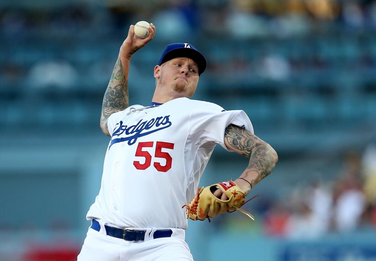 Dodgers right-hander Mat Latos pitches against the Reds.