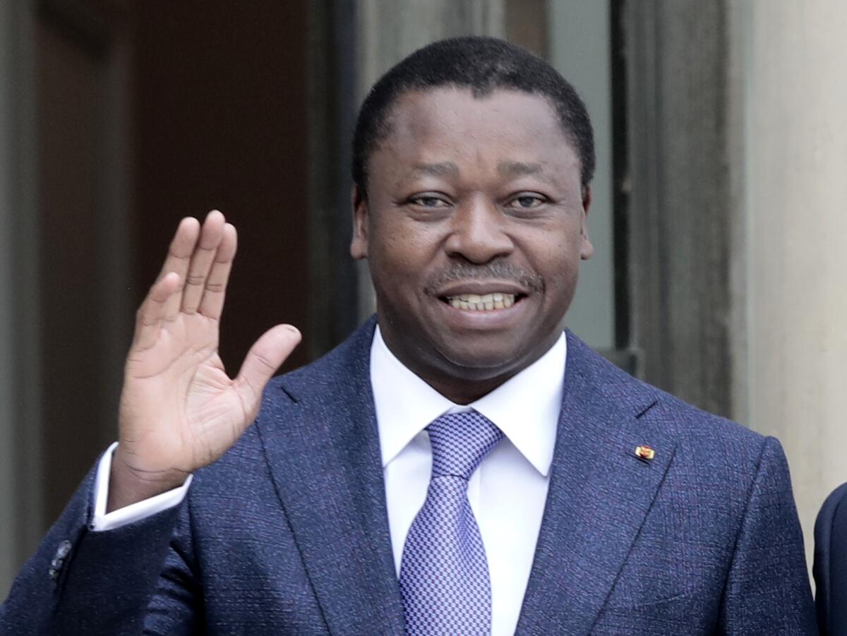 Togo's President Faure Gnassingbe waves.
