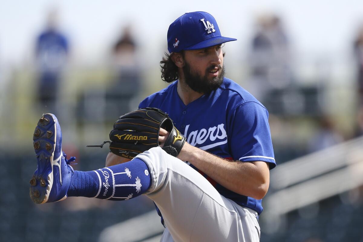 Dodgers pitcher Tony Gonsolin throws tossed 2 2/3 scoreless innings against the San Diego Padres on Monday.