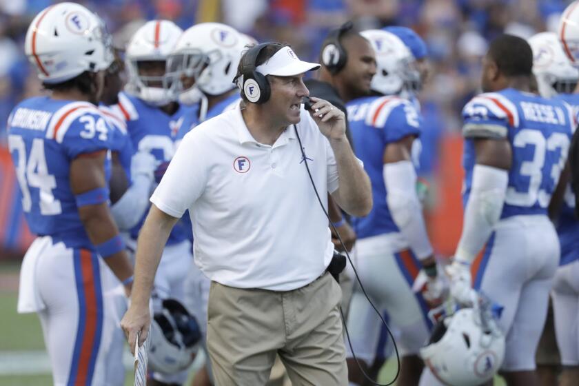 Florida head coach Dan Mullen directs his team against Auburn during the second half of an NCAA college football game, Saturday, Oct. 5, 2019, in Gainesville, Fla. (AP Photo/John Raoux)