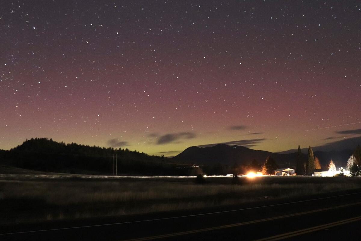 The northern lights glow above Yreka, Calif., Thursday evening. 