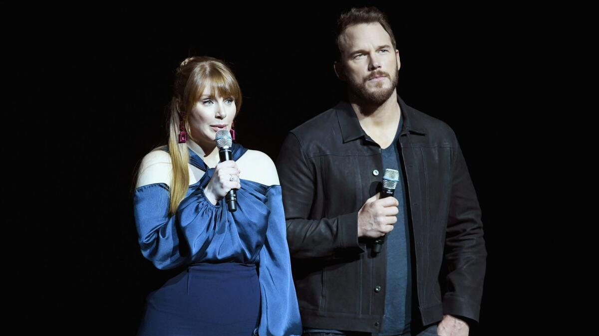Bryce Dallas Howard and Chris Pratt speak onstage during CinemaCon 2018.