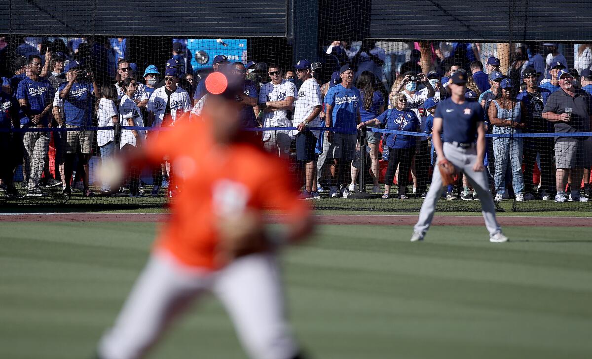Dodgers fans watch the Houston Astros warm up prior to a game against the Dodgers.