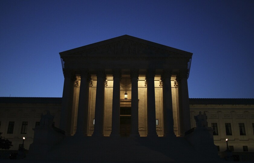 The Supreme Court exterior at night