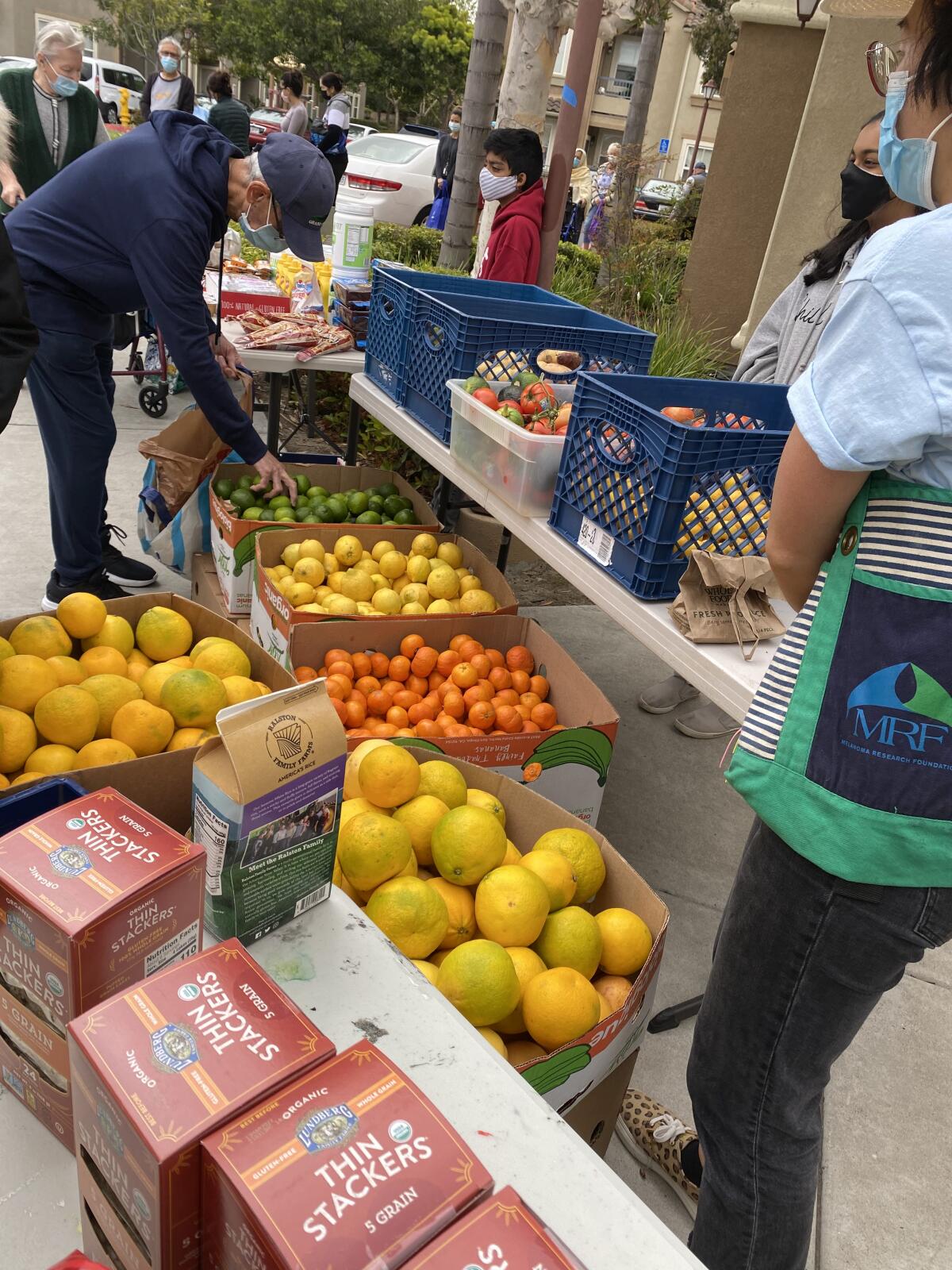 Fresh produce on display at a 92130 Cares food distribution event.