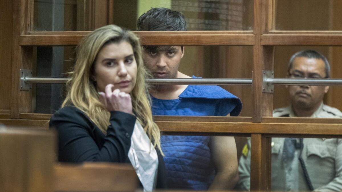 Rhett McKenzie Nelson, 30, of St. George, Utah, suspected of fatally shooting two men, including a Los Angeles County sheriff's deputy, appears for his arraignment in L.A. County Superior Court.