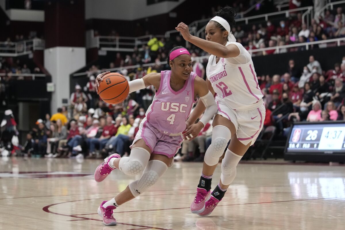 USC guard Kayla Williams, left, tries to drive past Stanford guard Indya Nivar.