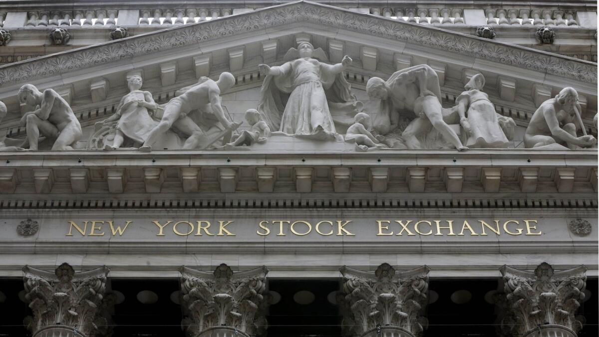 The facade of the New York Stock Exchange is shown.