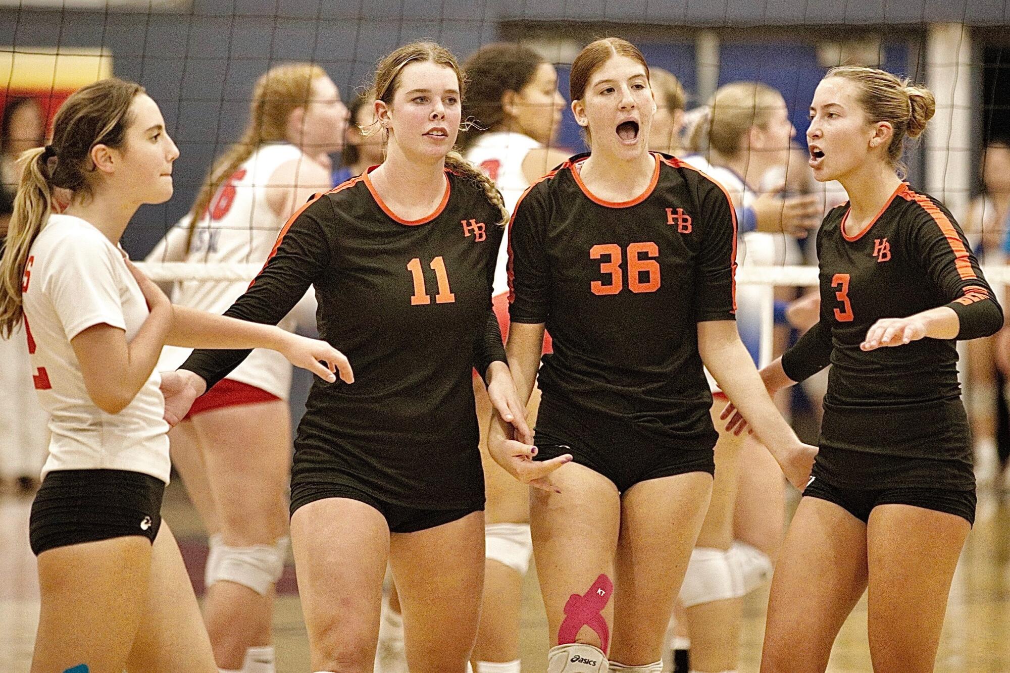 Huntington Beach players (from left) Olivia Foye, Haylee LaFontaine, Kylie Leopard and Dani Sparks huddle between points.