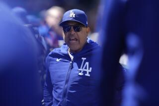 Los Angeles Dodgers manager Dave Roberts riles up players before the first inning.