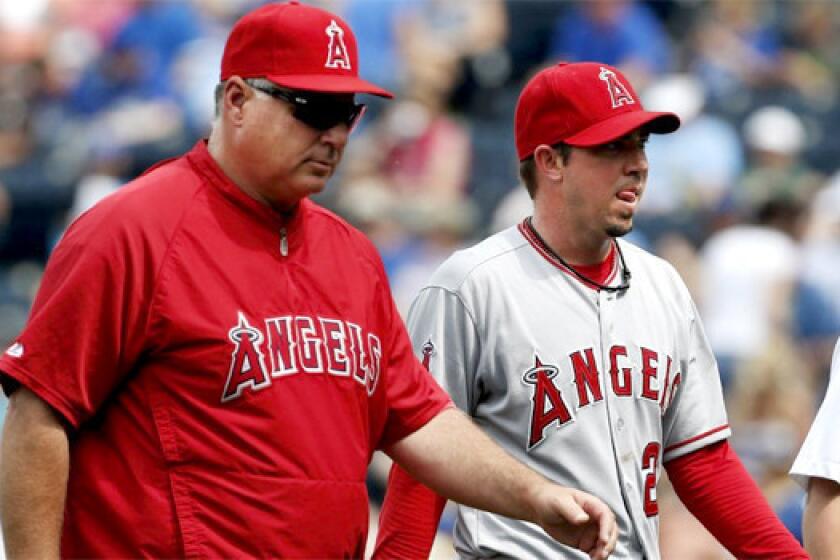 Sean Burnett's second visit to Dr. James Andrews didn't end with a surgical procedure, but the Angels left-hander has been ordered not to pick up a ball for a month.