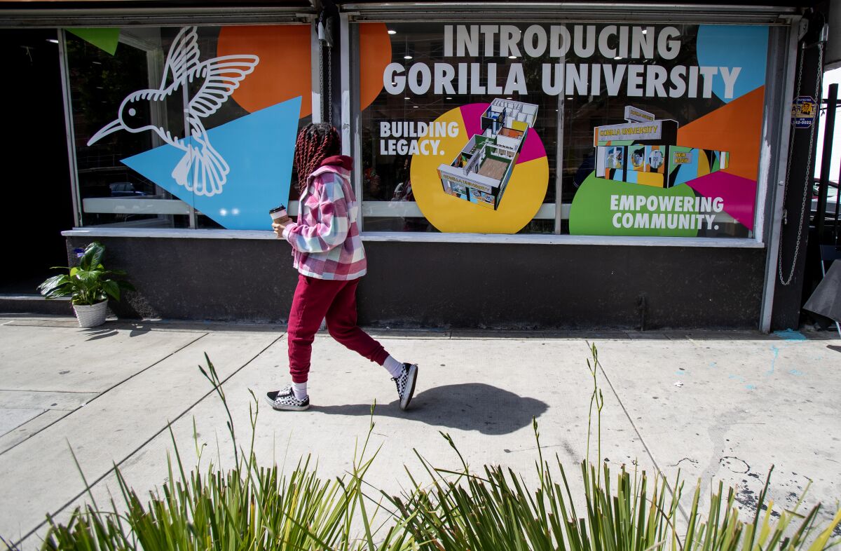 A pedestrian walks by the newly opened Gorilla University