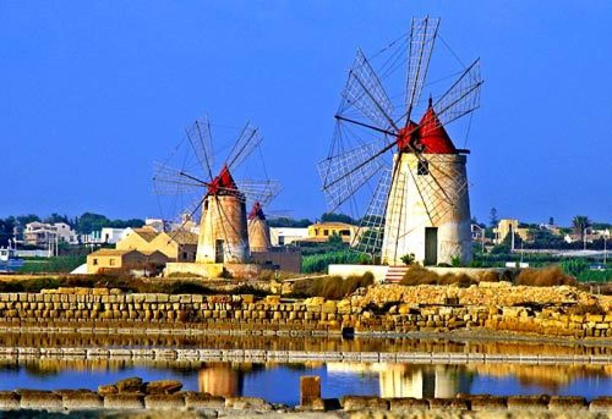 Windmills on salt flats north of Marsala are turned by the North African sirocco.