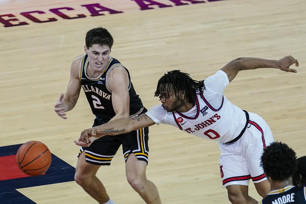 St. John's Posh Alexander knocks the ball away from Villanova's Collin Gillespie.