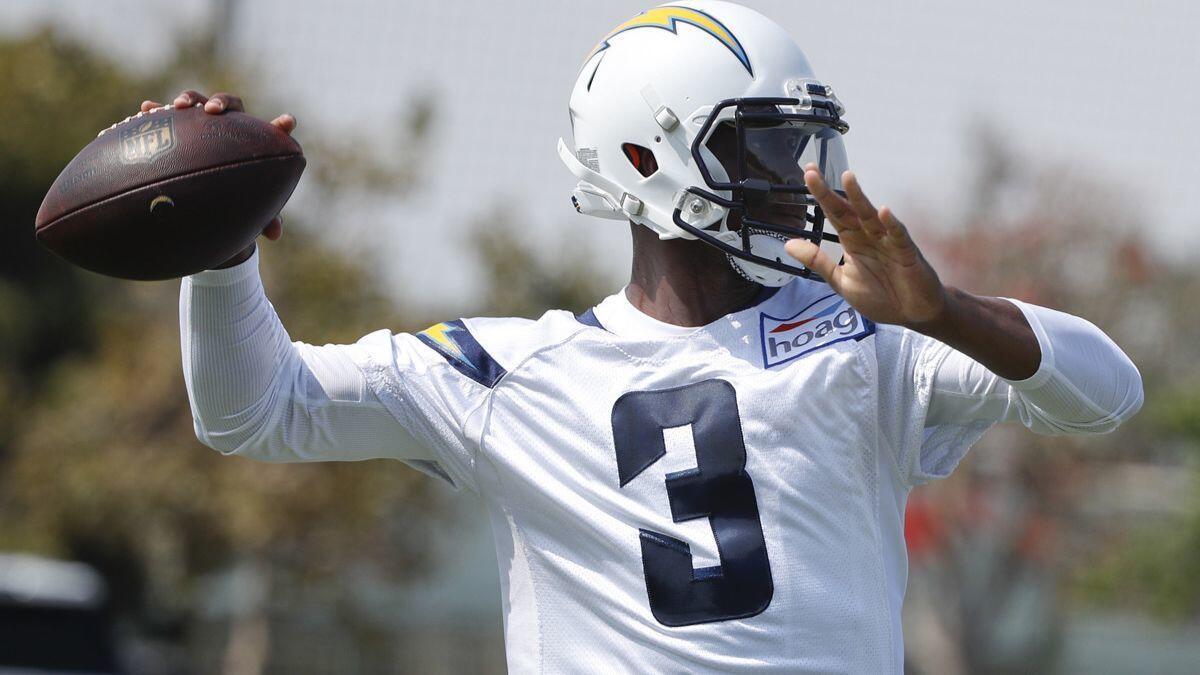 Chargers quarterback Geno Smith throws a pass during practice on July 28 in Costa Mesa.
