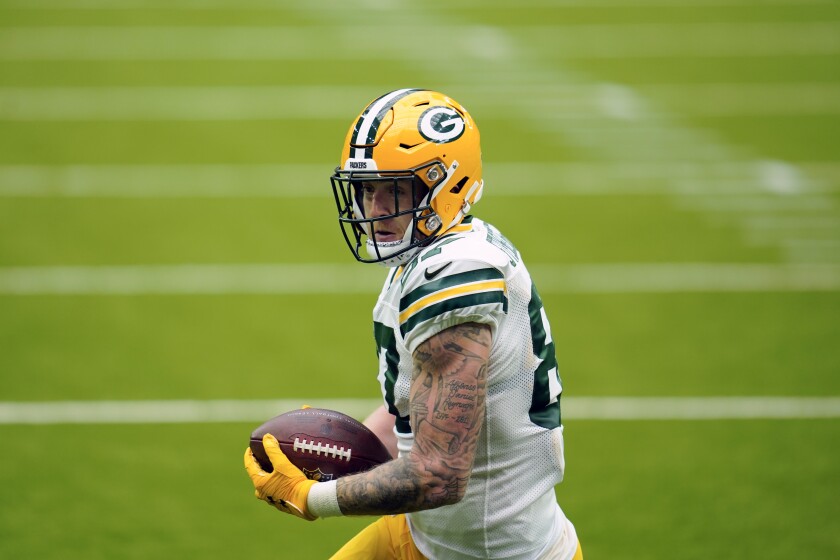 FILE - In this Sunday, Oct. 11, 2020, file photo, Green Bay Packers tight end Jace Sternberger (87) carries the ball after a reception for a touchdown during an NFL football game against the Houston Texans, in Houston. Sternberger has been suspended without pay for the first two games of the 2021 season for violating the NFL’s substance abuse policy. (AP Photo/Matt Patterson, File)
