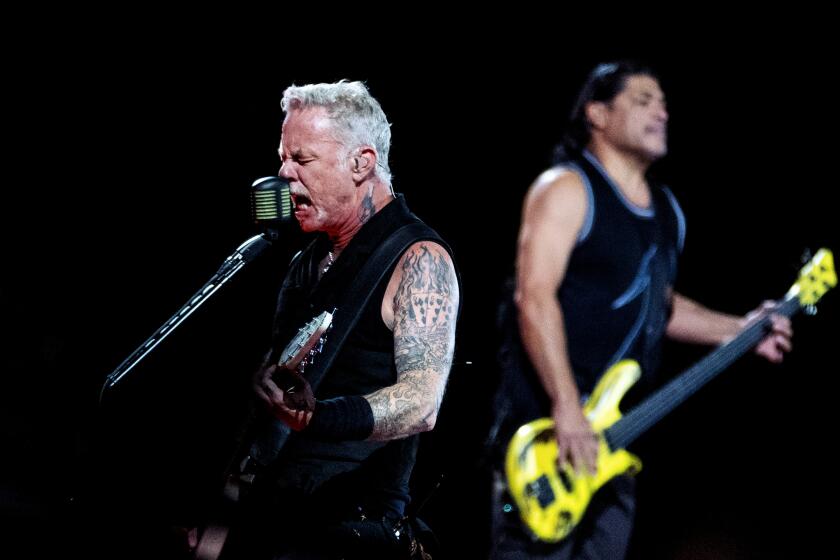James Hetfield, left, and Robert Trujillo of Metallica perform at the Metallica - M72 World Tour at SoFi Stadium on August 25, 2023 in Inglewood, California. (Photo by Ringo Chiu / For The Times)