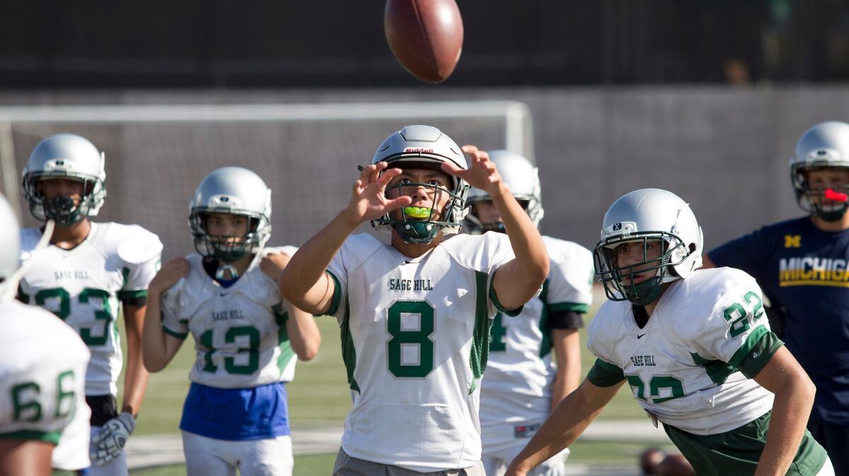 Senior quarterback Willie Leong takes a snap during a recent Sage Hill football practice. Leong is coming off a huge 2016 campaign where he passed for 40 touchdowns and ran for eight others.
