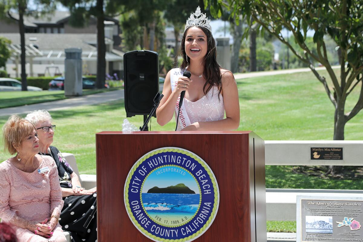 Gisell Gochman, 19, speaks during the Queen's Rose 57th Anniversary dedication at the Civic Center Rose Garden on Wednesday.