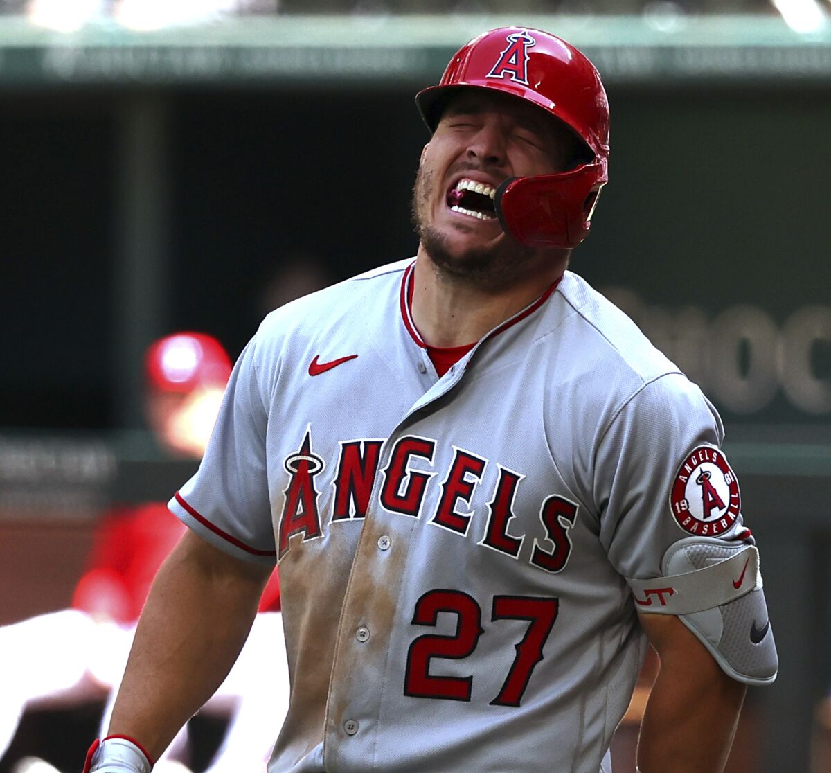 Angels star Mike Trout reacts after being hit by a pitch in the fifth inning in an 8-3 win over the Texas Rangers.