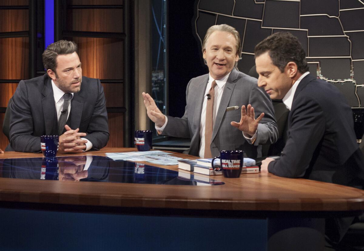HBO talk show host and political satirist Bill Maher, center, with actor Ben Affleck, left, and author Sam Harris.