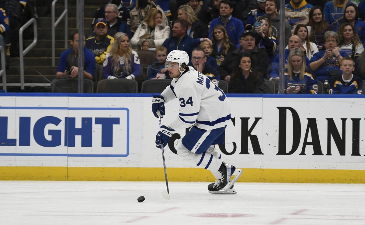 Toronto Maple Leafs center Auston Matthews (34) skates with the puck during the second period of an NHL hockey game against the St. Louis Blues on Saturday, Jan. 15, 2022, in St. Louis. (AP Photo/Arnold J. Ward)