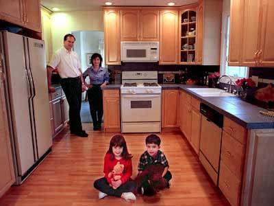 Rick and Stephanie Taylor, with Annamaria and Stephen, in their new kitchen.