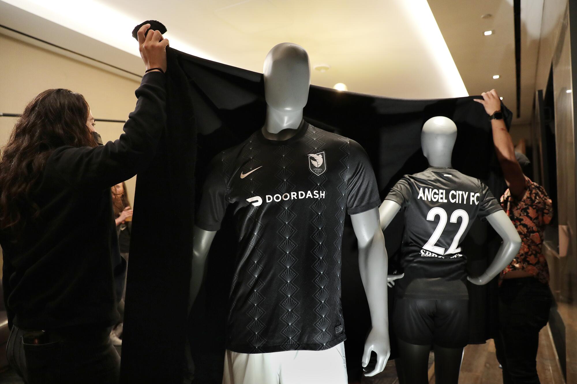Mannequins wear the new Angel City FC home jersey