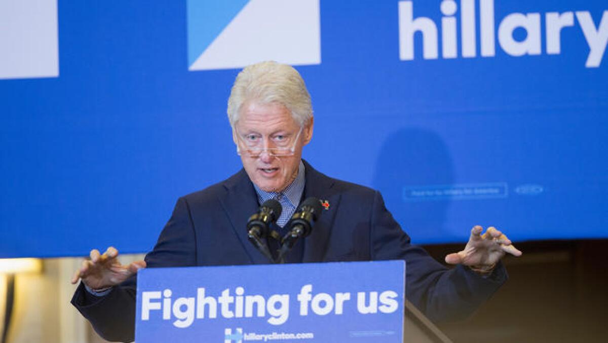 Former President Clinton campaigns for his wife, Democratic presidential candidate Hillary Clinton, on Jan. 7 in Dubuque, Iowa.