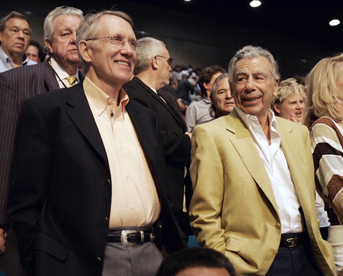 Senate Majority Leader Harry Reid, left, and Kirk Kerkorian attend the Oscar De La Hoya and Floyd Mayweather Jr. boxing match on May 5, 2007, at the MGM Grand Garden Arena in Las Vegas.