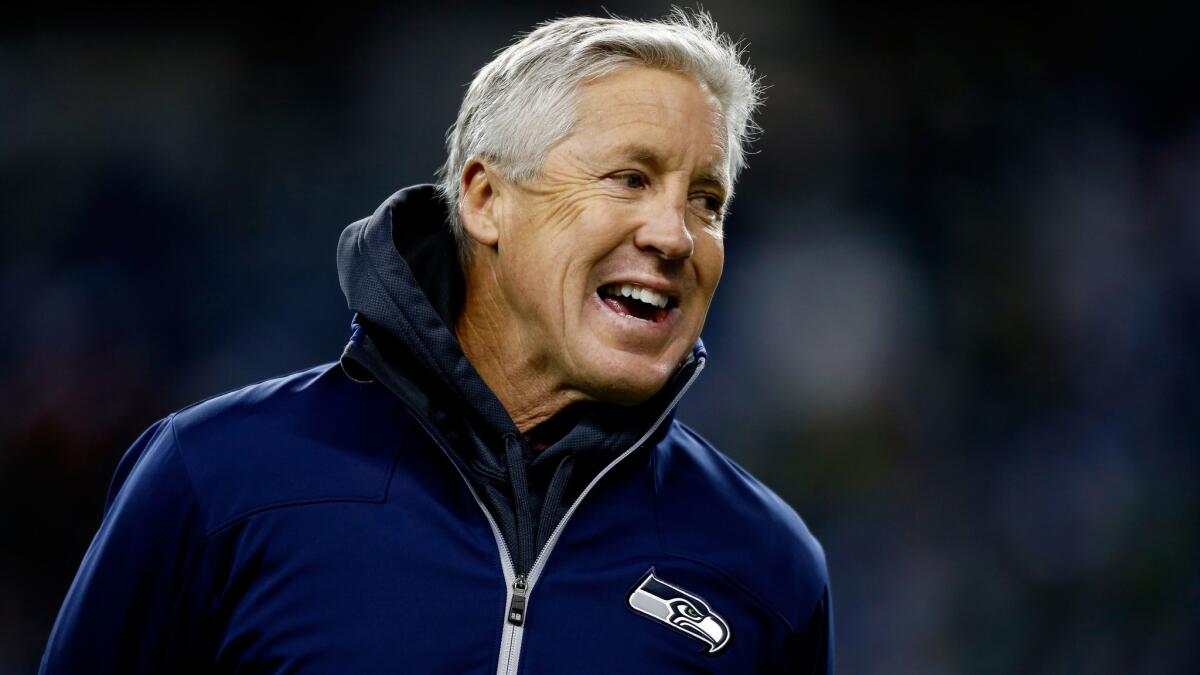 Seattle Seahawks Coach Pete Carroll smiles before a game against the New Orleans Saints in December. Carroll says he had no knowledge that NCAA sanctions were about to be imposed on USC when he left the university's football program.
