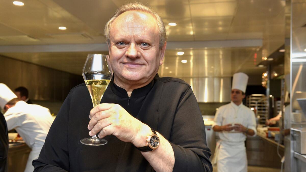 Joel Robuchon poses for a photograph in the kitchen of the Hotel de Ville in Crissier, Switzerland, on Dec. 17, 2013.