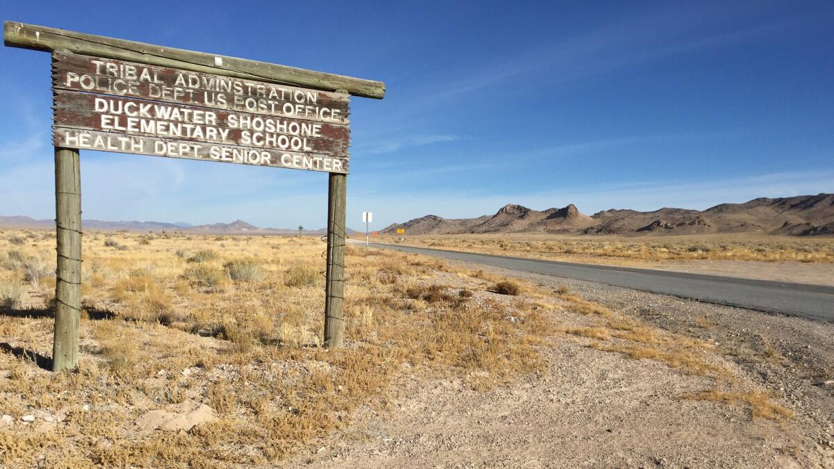 A sign off Highway 379 marks the entrance to Duckwater, Nev. The residents of the Duckwater Shoshone reservation have the longest trek to cast ballots in Nevada, about 270 miles round trip.