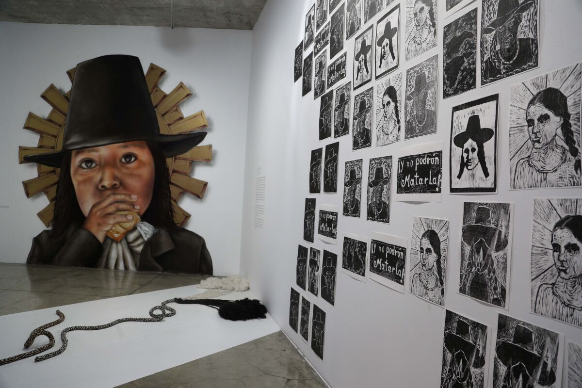 Images of Tupac Amaru and wife Micaela Bastidas are displayed at the Place of Memory, Tolerance and Social Inclusion museum in Lima, Peru, Saturday, May 16, 2021. Tupac Amaru was a muleteer and trader who claimed descent from Inca royals, led an Andean revolt against Spanish colonial rule and was executed on May 18, 1781. (AP Photo/Martin Mejia)