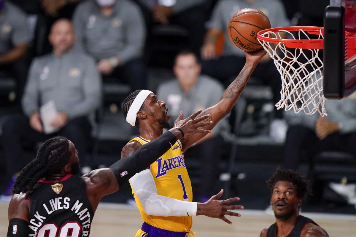 Lakers guard Kentavious Caldwell-Pope gets to the rim past Miami Heat forward Jae Crowder during Game 4 of the NBA Finals.