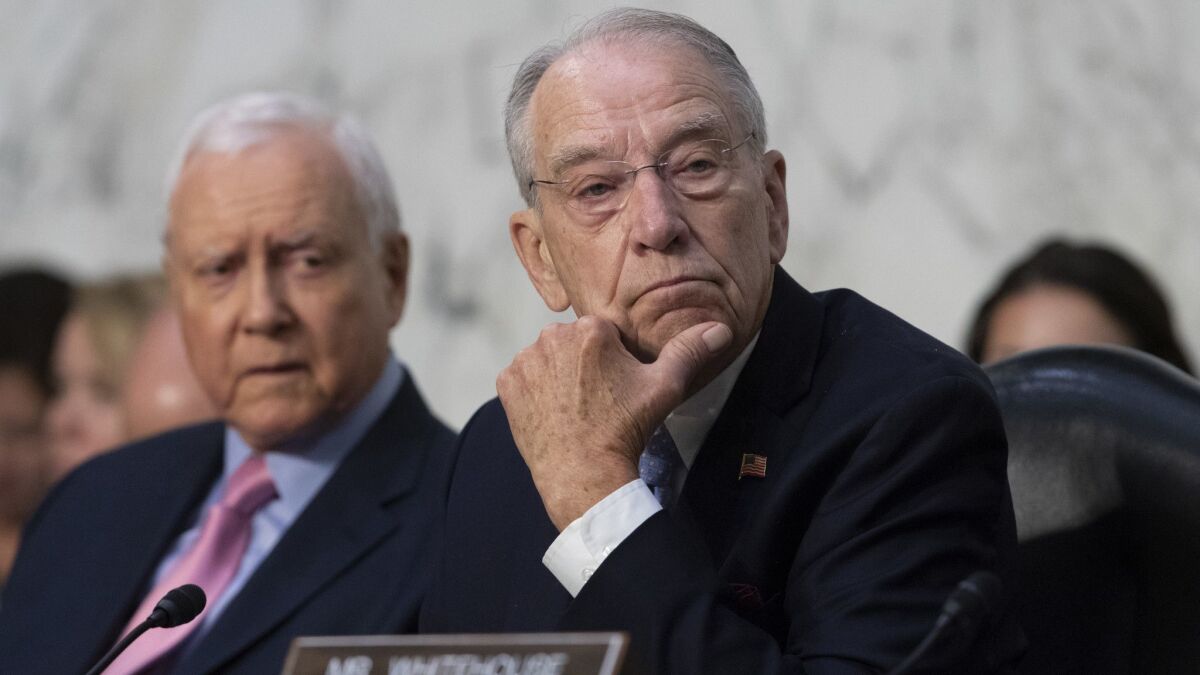 Senate Judiciary Committee Chairman Chuck Grassley, R-Iowa, joined at left by Sen. Orrin Hatch, R-Utah, at the confirmation hearing for Trump's Supreme Court nominee, Brett Kavanaugh, on Capitol Hill on Sept. 7.